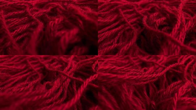 多莉开枪了。特写。针织红色羊毛背景。冬季针织服装。