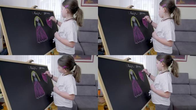 一个孩子在黑板上画画