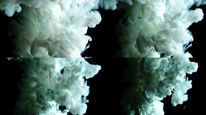 在慢动作反转中，真实的白色油漆滴在水中。墨水在水下旋转。黑色背景上孤立的墨水碰撞云。特写视图