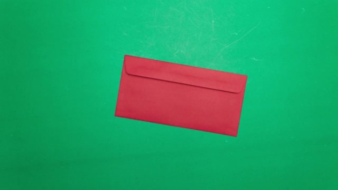 绿色背景上的停止运动动画红包。4k视频
