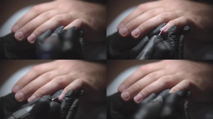 男性五金件修指甲-指甲大师使用小钻清洁角质层区域