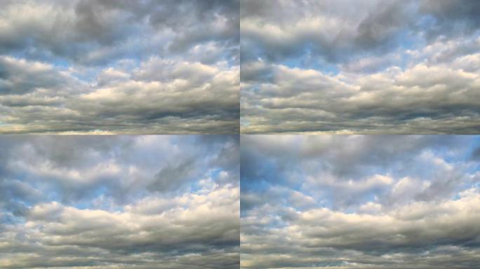 蓝天上快速移动的暴风云的延时镜头。