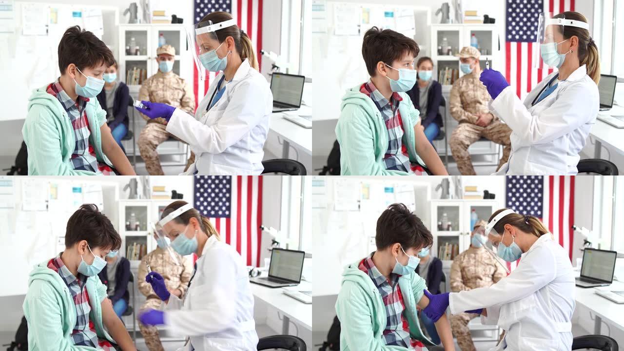4k视频: 医生给男孩接种疫苗。将新型冠状病毒肺炎疫苗注射到患者的手臂中