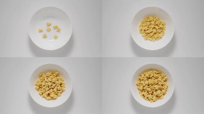 早餐儿童玉米片出现在白盘中，停止运动
