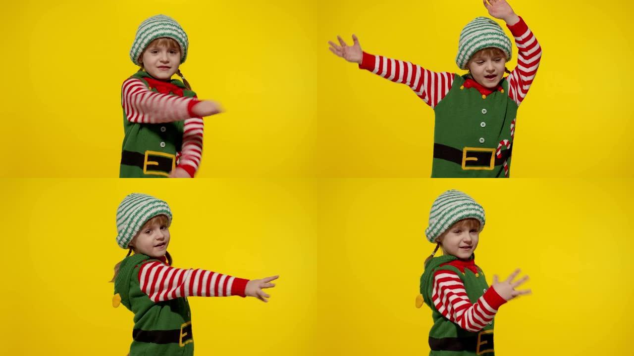 小女孩穿着圣诞精灵圣诞老人帮手服装跳舞，鬼混。新年假期庆祝活动