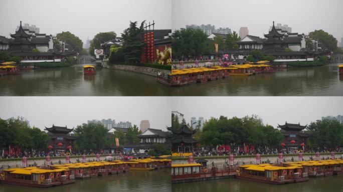 雨天南京市著名旅游古城河滨广场交通慢动作全景4k中国