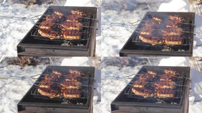 户外冬季烧烤派对，在露营地烧烤的热煤上烧烤牛排，露营生活方式，特写镜头