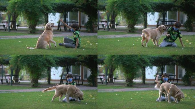 大流行期间，小男孩在公园和她的狗玩耍。