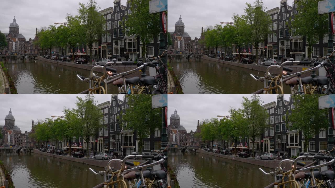 多云的一天阿姆斯特丹市中心著名的运河桥景观慢动作全景4k荷兰