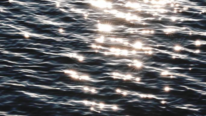 波光粼粼的蓝色水面泛起点点星光