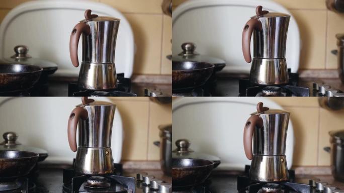 家用脏煤气炉上的间歇泉咖啡机。