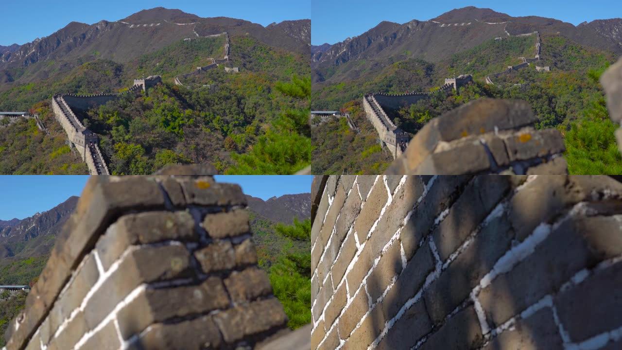 在秋天开始时，中国长城在山坡上升起的Slowmotion steadicam镜头。摄像机向下移动。