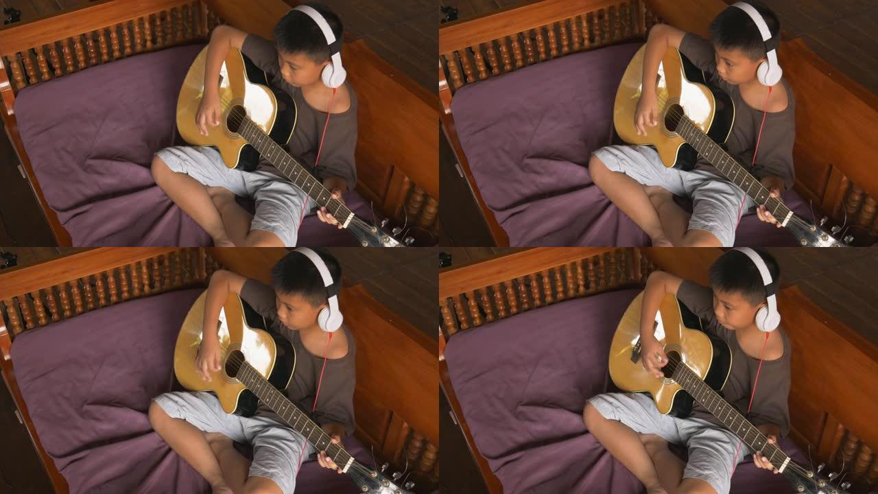 男孩学弹古典吉他