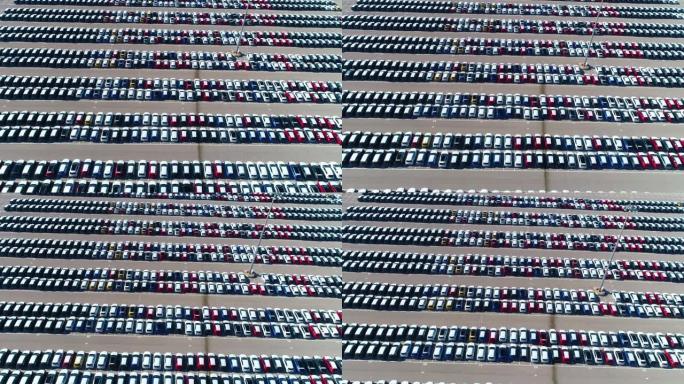鸟瞰图，无人机在白天停在停车场的彩色汽车上方。西班牙4k停车场的无人机美景