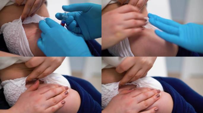 戴着蓝色手套的医生为诊所的小孩接种疫苗