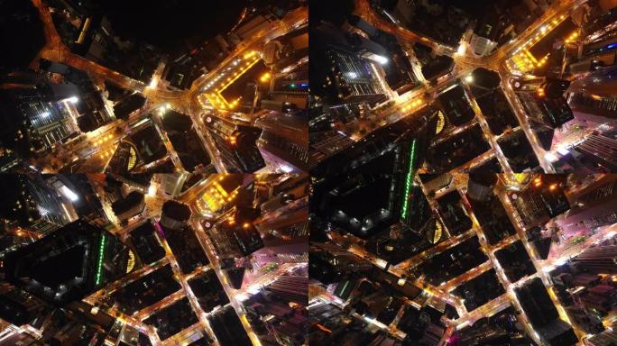 夜间照明香港城市景观市中心交通街俯冲空中全景4k