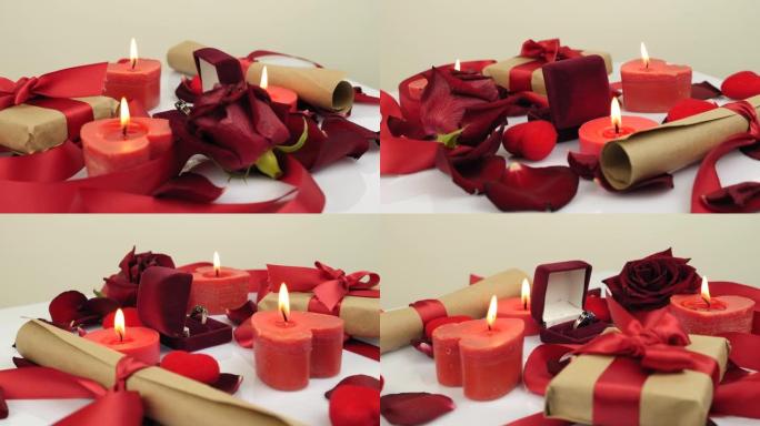 情人节惊喜。装饰浪漫的背景，燃烧的蜡烛，玫瑰花瓣和礼物。订婚戒指在白色背景上旋转。假日惊喜。浪漫的问