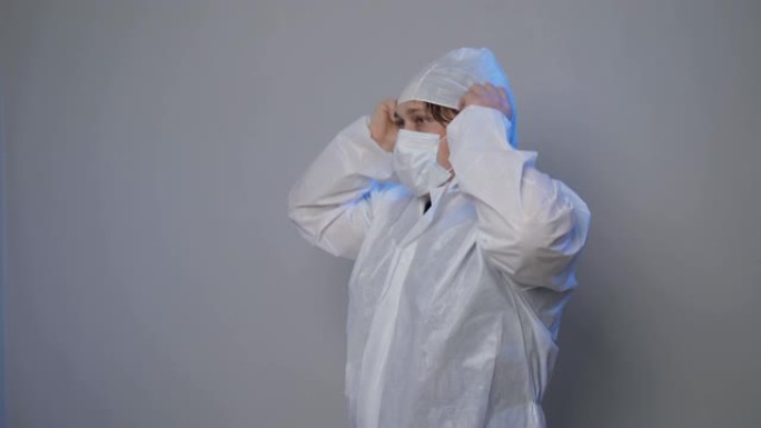 医学病毒学家。新型冠状病毒肺炎大流行。病毒学家在干净的区域戴上面罩和面罩。
