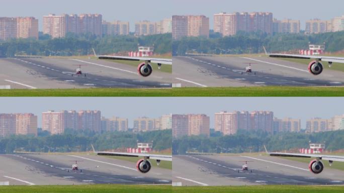 小型涡轮螺旋桨飞机与宽体客机在跑道上排队