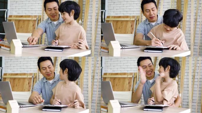 亚洲男木匠教儿子如何在车间用木头工作。