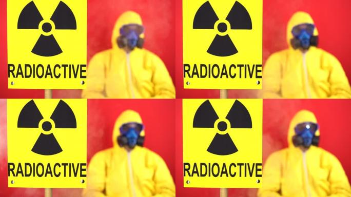 铭文放射性和烟雾中的辐射迹象，以及背景中穿着防护服的男人