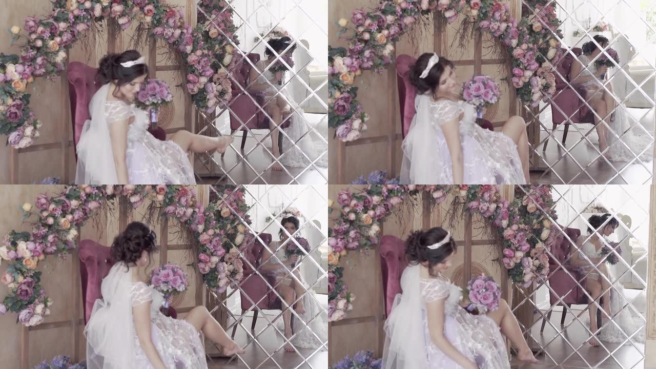 慢动作新娘坐在花拱下对着镜子