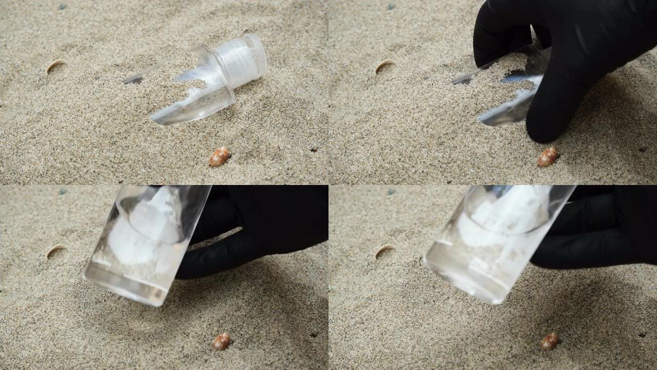 男人发现塑料洗手液，海岸上的医疗垃圾，covid污染