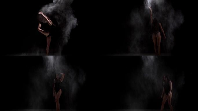 优雅的黑人舞者在芭蕾舞剧中撒下灰尘