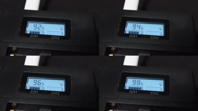 充电器的屏幕在桌子上显示电池百分比的数据
