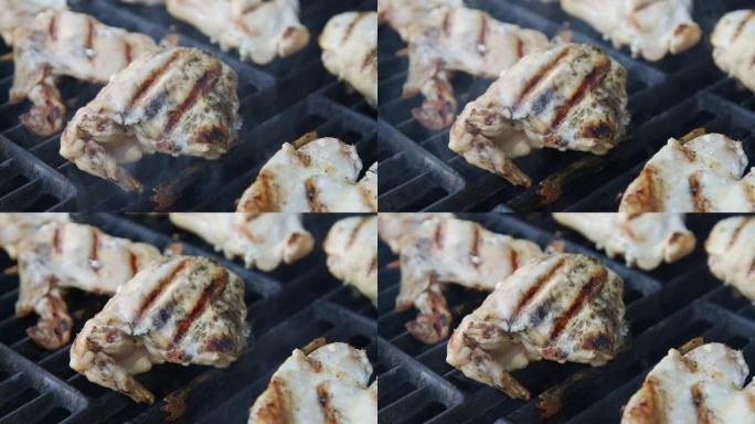 在美国午餐或晚餐时，在户外烹饪的鸡肉上手持烧烤痕迹的照片