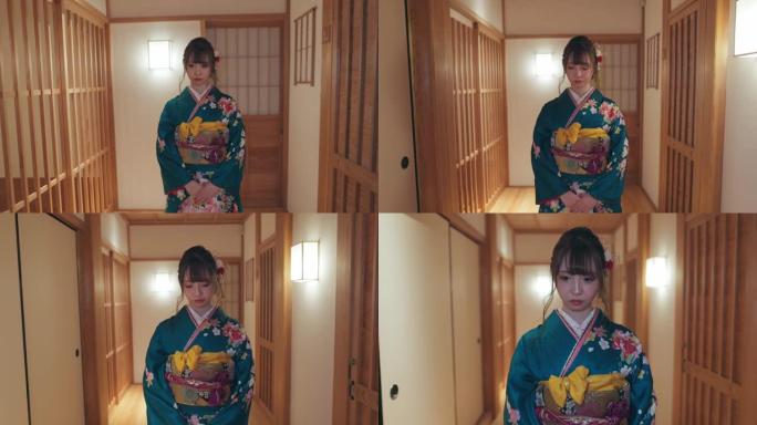 穿着 “furisode” 和服的年轻女性在日本 “日式旅馆” 的走廊上行走