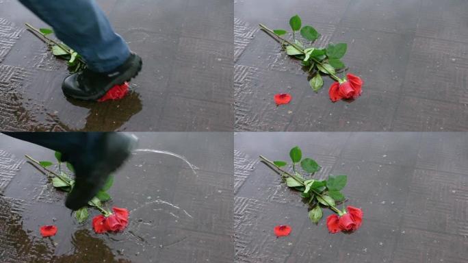 在公园散步的人们踩着一朵红玫瑰扔进水坑
