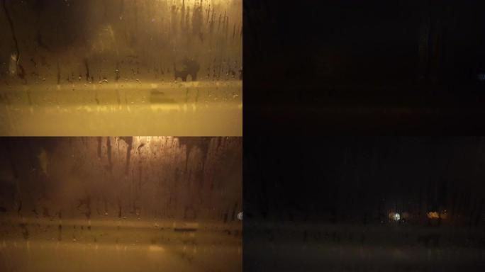 夜间行驶的汽车侧窗下雨