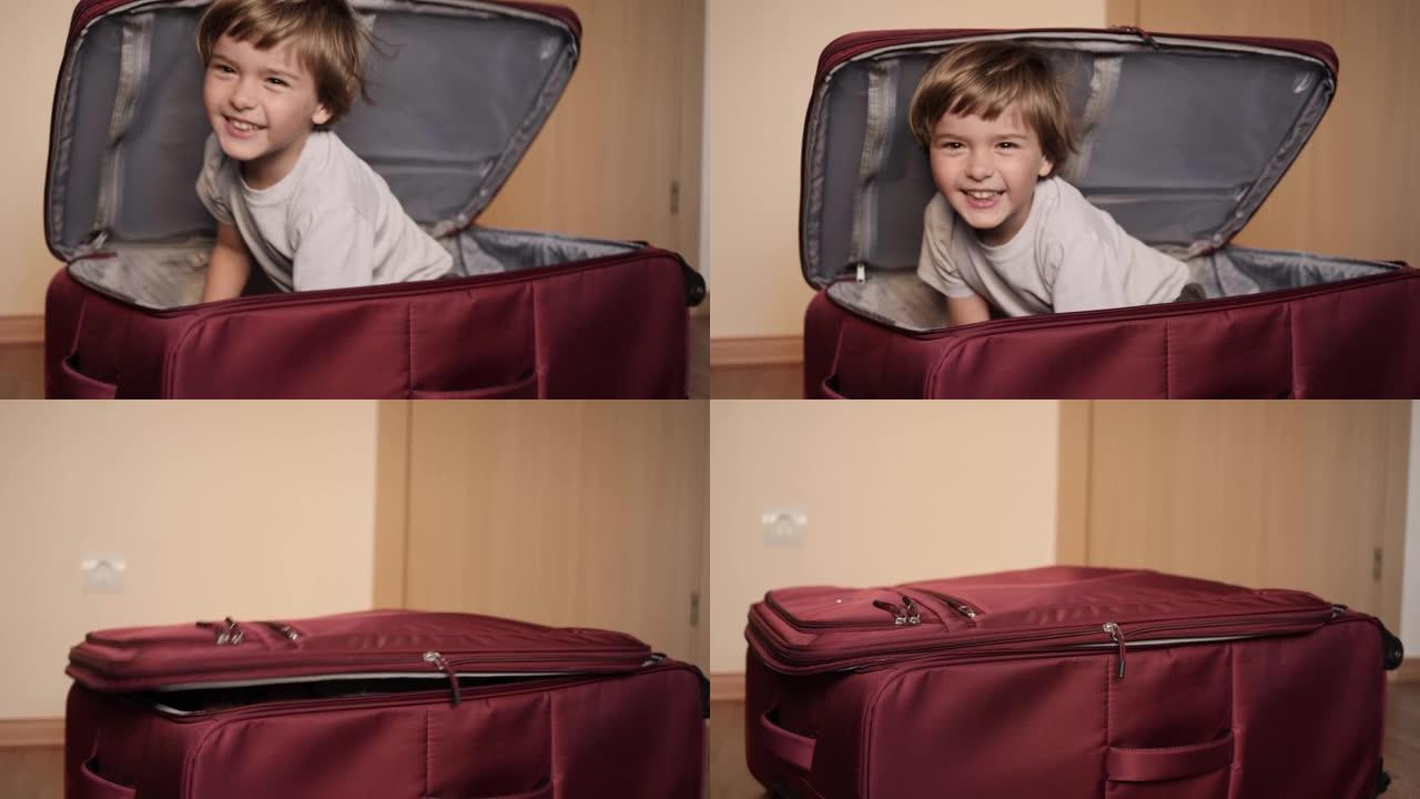 小孩在手提箱里玩。旅行车里的小孩。打包度假。快乐的儿童男孩游客从红色手提箱中寻找旅行度假冒险。孩子在