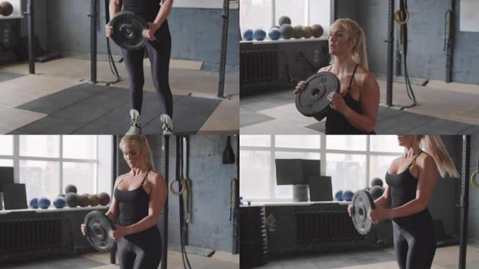 强壮的女人在健身房做加权板弓步