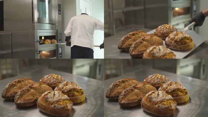 一个面包师从烤箱里拿出新鲜出炉的面包的演示视频。在面包店烤面包。脆皮新鲜面包