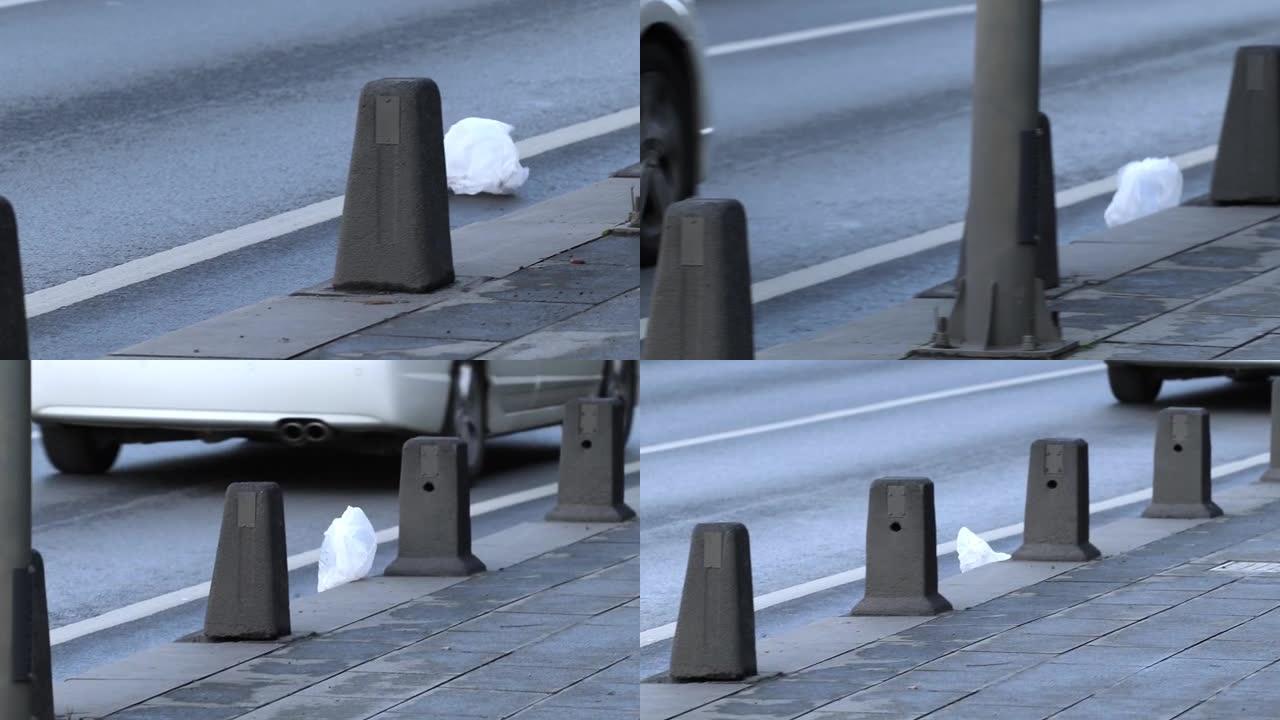 风在人行道上携带一个塑料袋。