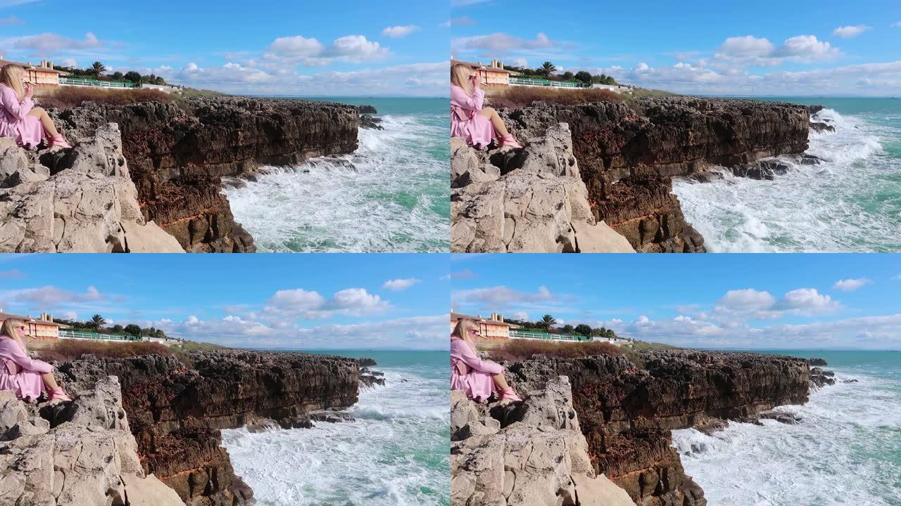 在晴朗的天气里，强大的海浪撞击岩石。纯粹的力量，自然力量的展示。强能量。对抗地球的海洋力量。年轻的金
