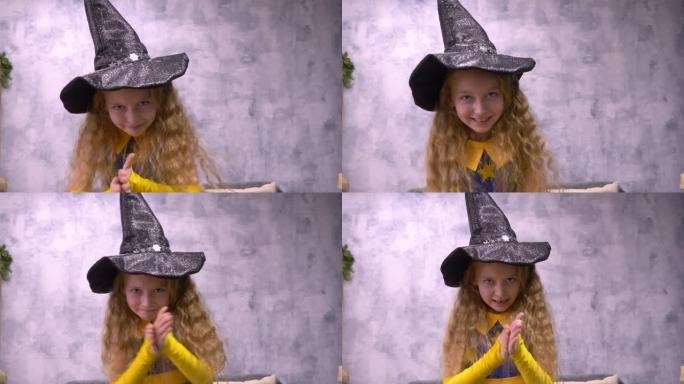 狡猾的女巫占星家贪婪地看着镜头。年轻的白人女孩万圣节长头发服装