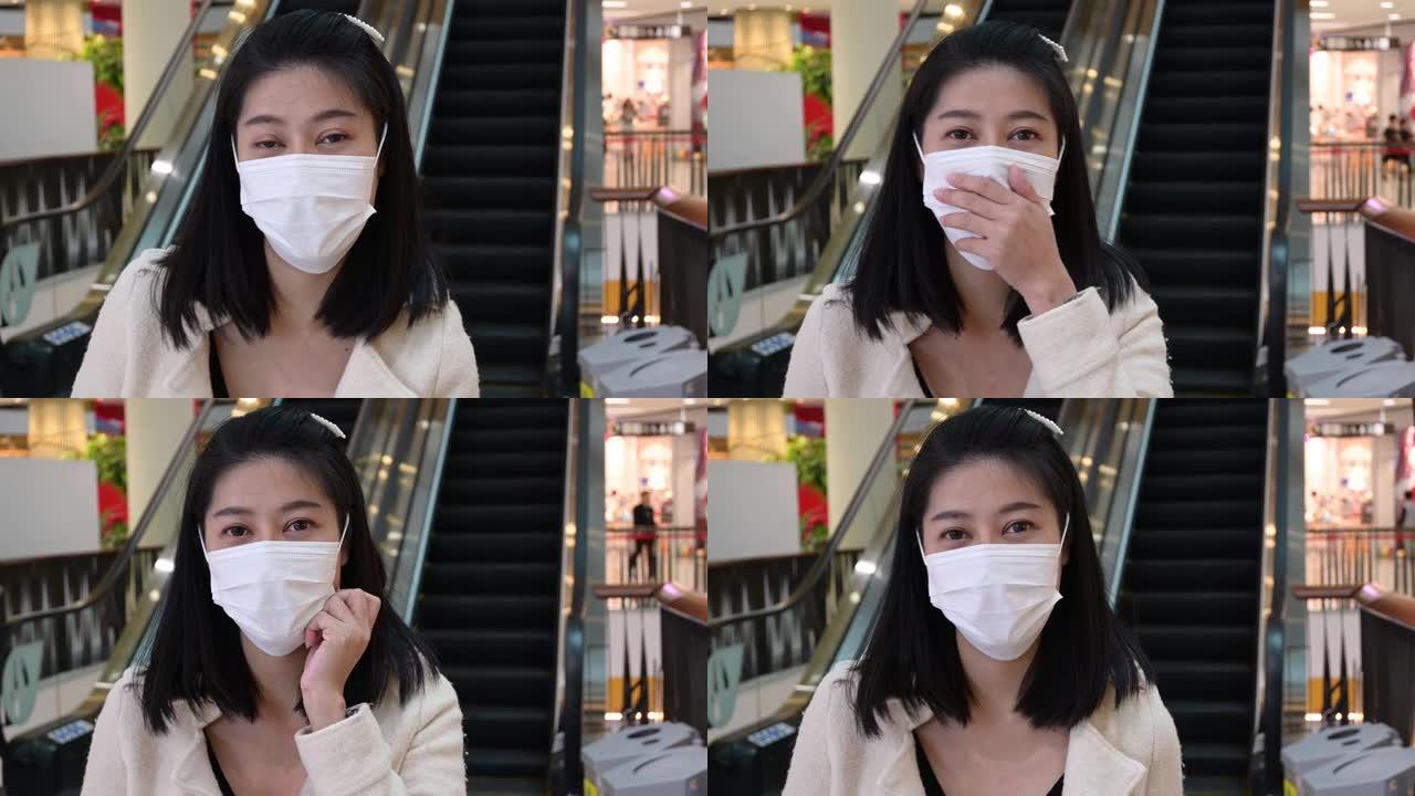 亚洲妇女戴卫生口罩防护形式疾病在商场大流行