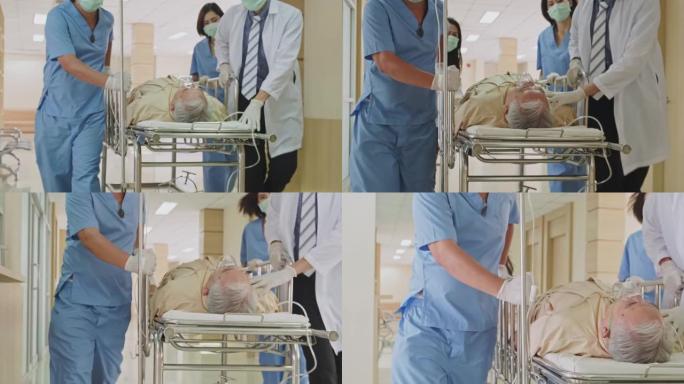 一组医生，护士和外科医生将严重受伤的病人躺在担架上穿过医院的走廊。医务人员急忙将急诊老病人搬进手术室