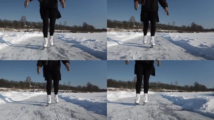 穿着裙子和白色花样溜冰鞋的浪漫年轻女子独自在冰冻的河上滑冰。冬季，女性的脚在冰上滑冰。户外滑冰