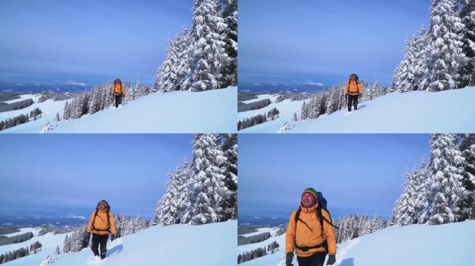 一位游客在山上的雪中漫步。