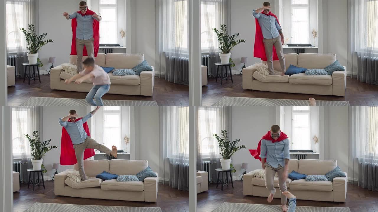 父亲和儿子在公寓里玩游戏。穿着红色斗篷和眼镜的爸爸描绘了超人。