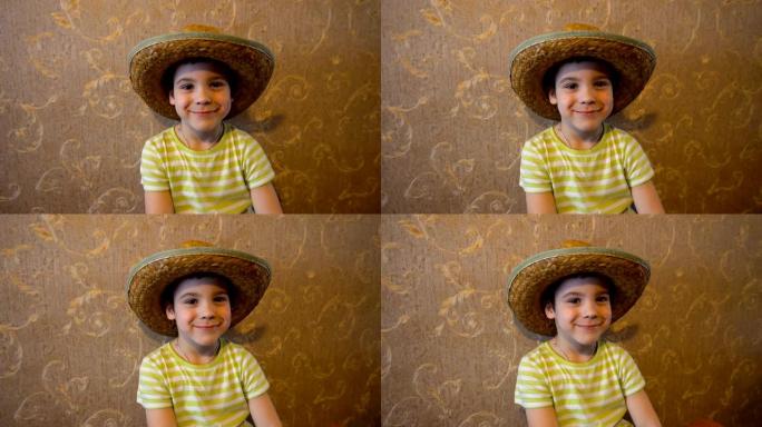 戴着草帽的男孩坐在墙上贴着墙纸