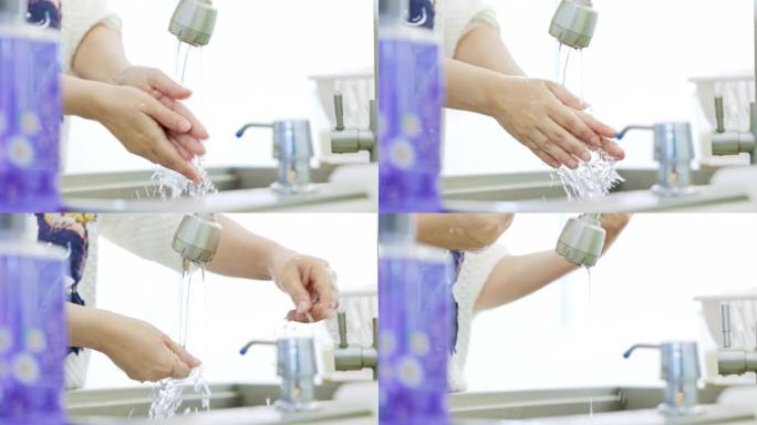 女人在水槽里用洗手液洗手。清洁手概念的想法。冠状病毒保护。