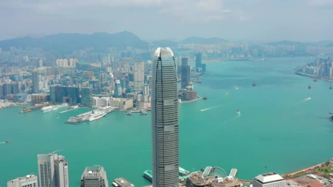 阳光灿烂的香港城市景观市中心著名的威震天维多利亚港空中全景4k