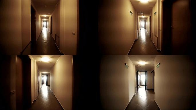 低角度步行穿过长而空的黑暗建筑走廊，电影摄影机拍摄