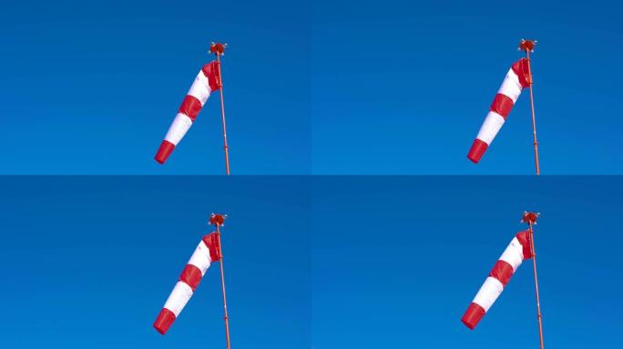 风向袋在蓝色无云的天空背景下发展。