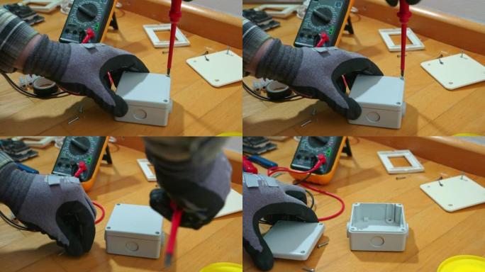 电工用螺丝刀卸下螺丝，以取下电气盒的盖子